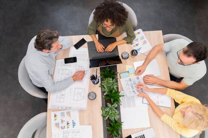 Business professionals reviewing workplace skills plans and training reports to reclaim Skills Development Levy grants in South Africa